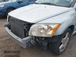 2009 Dodge Caliber SXT with VIN 1B3HB48A59D143888, listed as a IAAI auction lot 42110334 with 182,674 mi miles and . Bid and sale history available at DreamBid. Image 6.