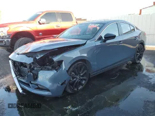 2024 Mazda 3 S Carbon Edition with VIN 3MZBPBCM9RM410396, listed as a Copart auction lot 63052785 with 21,140 mi miles and Salvage title. Bid and sale history available at DreamBid. Image 1.