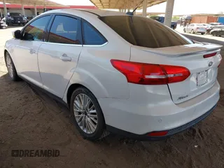 2015 Ford Focus Titanium with VIN 1FADP3J28FL256155, listed as a IAAI auction lot 42350610 with 53,840 mi miles and . Bid and sale history available at DreamBid. Image 3.