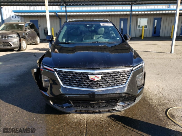2024 Cadillac XT4 AWD Premium Luxury with VIN 1GYFZDR49RF128402, listed as a Copart auction lot 77630154 with 20,673 mi miles and Salvage Title. Bid and sale history available at carsss.com. Image 5.