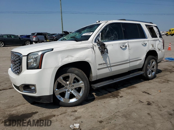2019 GMC Yukon Denali with VIN 1GKS1CKJ7KR194428, listed as a Copart auction lot 71191064 with 56,409 mi miles and Salvage Title. Bid and sale history available at carsss.com. Image 1.