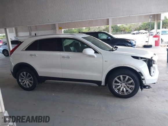 2019 Cadillac XT4 FWD Premium Luxury z VIN 1GYFZCR49KF142039, wystawiony jako IAAI lot #42259448 z przebiegiem 47 620 mil mil oraz . Historia ofert i sprzedaży dostępna na DreamBid. Obrazek 14.
