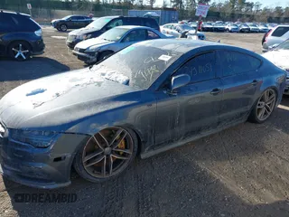 2016 Audi S7 z VIN WAUW2AFCXGN031858, wystawiony jako IAAI lot #41182675 z przebiegiem Nie podano mil oraz . Historia ofert i sprzedaży dostępna na DreamBid. Obrazek 13.