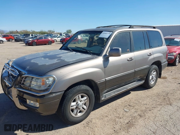 2000 Lexus LX 470 with VIN JT6HT00WXY0079873, listed as a IAAI auction lot 41605770 with 302,758 mi miles and . Bid and sale history available at DreamBid. Image 2.
