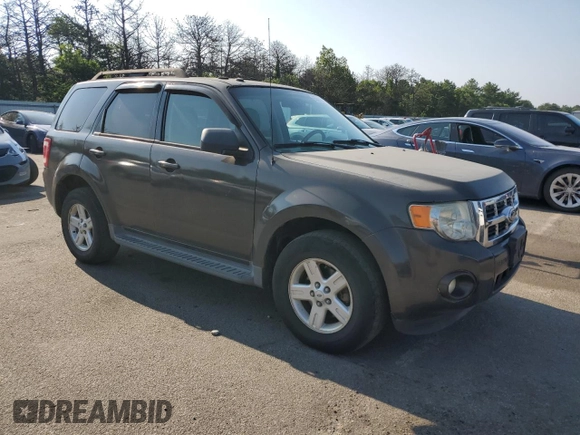 2011 Ford Escape Hybrid with VIN 1FMCU4K35BKA16469, listed as a Copart auction lot 65811905 with 401,583 mi miles and Clean title. Bid and sale history available at DreamBid. Image 4.