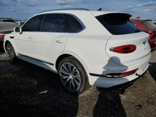 2022 Bentley Bentayga V8 z VIN SJAAM2ZV4NC011285, wystawiony jako Copart lot #75246624 z przebiegiem 33 179 mil mil oraz Nie do naprawy. Historia ofert i sprzedaży dostępna na DreamBid. Obrazek 2.