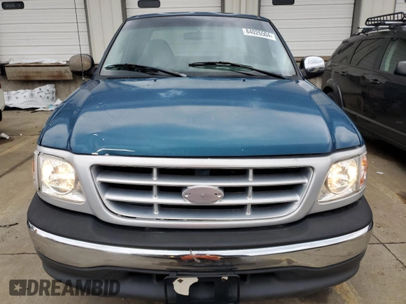 2000 Ford F-150 XL with VIN 1FTRX17W5YNA58235, listed as a Copart auction lot 84026504 with 0 mi miles and Salvage Title. Bid and sale history available at carsss.com. Image 5.