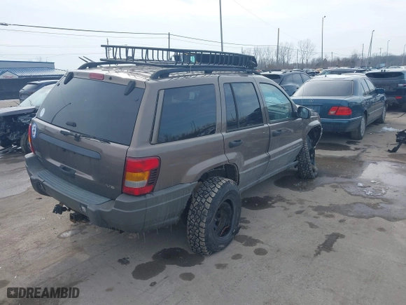 2002 Jeep Grand Cherokee Laredo with VIN 1J4GW48N12C193792, listed as a IAAI auction lot 41545283 with 166,720 mi miles. Bid and sale history available at carsss.com. Image 4.