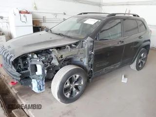 2016 Jeep Cherokee Trailhawk with VIN 1C4PJMBS0GW169184, listed as a IAAI auction lot 42255346 with 152,802 mi miles and . Bid and sale history available at DreamBid. Image 2.