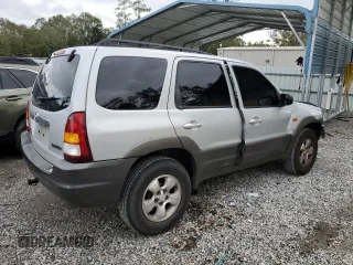 2003 Mazda Tribute LX with VIN 4F2YZ04153KM20941, listed as a Copart auction lot 82683264 with 195,240 mi miles and Salvage Title. Bid and sale history available at DreamBid. Image 3.