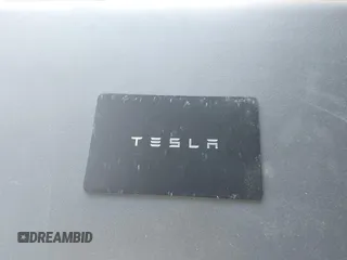 2024 Tesla Model Y with VIN 7SAYGDEDXRA300743, listed as a IAAI auction lot 41690374 with 12,446 mi miles and . Bid and sale history available at DreamBid. Image 11.