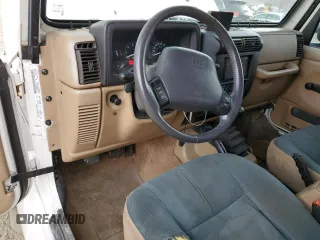 2000 Jeep Wrangler Sahara with VIN 1J4FA59SXYP760278, listed as a Copart auction lot 60402485 with 192,161 mi miles and Salvage title. Bid and sale history available at DreamBid. Image 8.