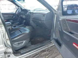 2000 Jeep Grand Cherokee Limited z VIN 1J4GW58N1YC206992, wystawiony jako IAAI lot #42057236 z przebiegiem 183 986 mil mil oraz . Historia ofert i sprzedaży dostępna na DreamBid. Obrazek 5.