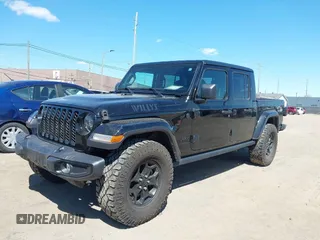 2022 Jeep Gladiator Texas Trail with VIN 1C6HJTAG2NL120506, listed as a IAAI auction lot 42048215 with 65,048 mi miles. Bid and sale history available at carsss.com. Image 2.