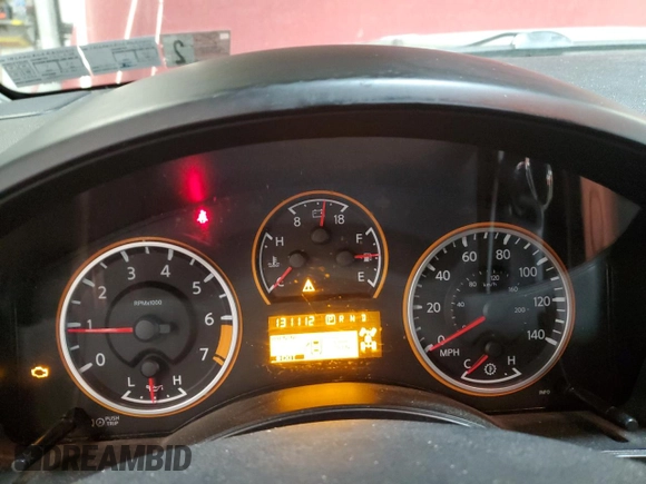 2014 Nissan Titan Pro-4X z VIN 1N6AA0EC6EN501437, wystawiony jako Copart lot #82822234 z przebiegiem 131 112 mil mil oraz Szkoda całkowita • Salvage title. Historia ofert i sprzedaży dostępna na DreamBid. Obrazek 9.
