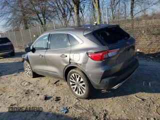 2021 Ford Escape Titanium with VIN 1FMCU9J90MUB16909, listed as a Copart auction lot 42547724 with 24,300 mi miles and Salvage Title. Bid and sale history available at carsss.com. Image 2.