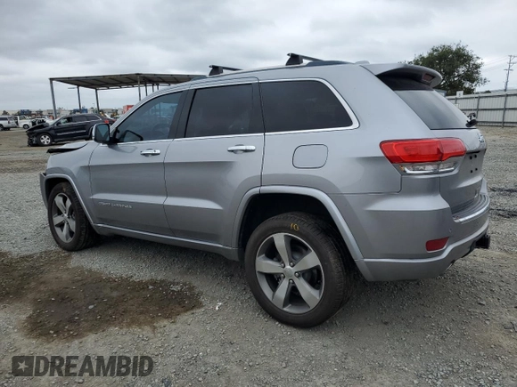 2015 Jeep Grand Cherokee Overland with VIN 1C4RJECG4FC808241, listed as a Copart auction lot 59699685 with 67,542 mi miles and Salvage title. Bid and sale history available at DreamBid. Image 2.