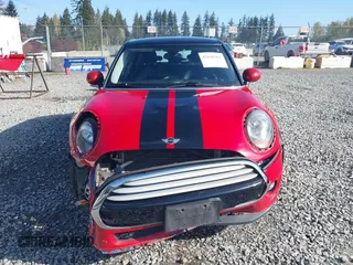 2015 MINI Hardtop 4 Door z VIN WMWXS5C59FT829635, wystawiony jako IAAI lot #42046985 z przebiegiem 171 731 mil mil oraz . Historia ofert i sprzedaży dostępna na DreamBid. Obrazek 13.