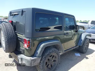 2015 Jeep Wrangler Sport with VIN 1C4AJWAGXFL650428, listed as a IAAI auction lot 42010629 with 80,039 mi miles. Bid and sale history available at carsss.com. Image 4.
