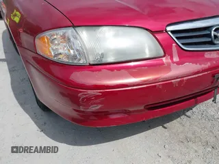 2000 Mazda 626 LX with VIN 1YVGF22C8Y5115891, listed as a IAAI auction lot 42121137 with 186,165 mi miles. Bid and sale history available at carsss.com. Image 6.