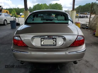 2003 Jaguar S-Type z VIN SAJEA01U53HM58399, wystawiony jako Copart lot #62006044 z przebiegiem 86 841 mil mil oraz Szkoda całkowita • Salvage title. Historia ofert i sprzedaży dostępna na DreamBid. Obrazek 6.