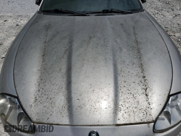 1999 Jaguar XK z VIN SAJGX2049XC034022, wystawiony jako Copart lot #55690025 z przebiegiem Nie podano mil oraz Tytuł czysty. Historia ofert i sprzedaży dostępna na DreamBid. Obrazek 11.