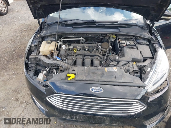 2016 Ford Focus Titanium z VIN 1FADP3J27GL215436, wystawiony jako IAAI lot #42709166 z przebiegiem 75 956 mil mil oraz . Historia ofert i sprzedaży dostępna na DreamBid. Obrazek 10.