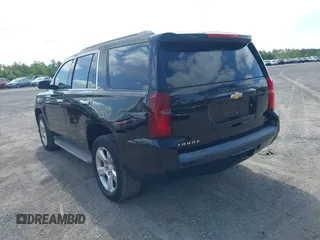 2015 Chevrolet Tahoe LT with VIN 1GNSCBKC1FR615817, listed as a IAAI auction lot 41760474 with 242,148 mi miles and . Bid and sale history available at DreamBid. Image 3.