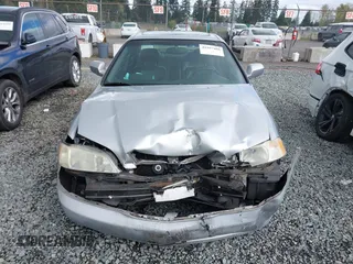 1999 Acura TL with VIN 19UUA5657XA021688, listed as a IAAI auction lot 41997466 with 241,232 mi miles. Bid and sale history available at carsss.com. Image 12.