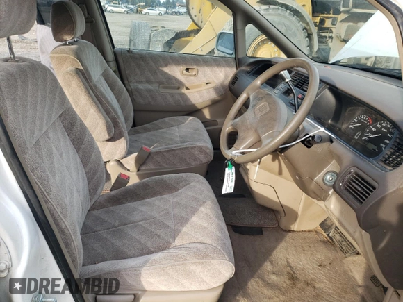 1998 Honda Odyssey with VIN RA31038664, listed as a Copart auction lot 43051785 with 106,084 mi miles and Salvage title. Bid and sale history available at DreamBid. Image 7.