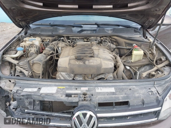 2013 Volkswagen Touareg Lux with VIN WVGEF9BP1DD012851, listed as a IAAI auction lot 41732391 with 123,283 mi miles and . Bid and sale history available at DreamBid. Image 10.