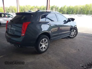 2016 Cadillac SRX Luxury Collection z VIN 3GYFNEE39GS555747, wystawiony jako IAAI lot #42347516 z przebiegiem 143 061 mil mil oraz . Historia ofert i sprzedaży dostępna na DreamBid. Obrazek 4.
