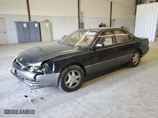 1996 Lexus ES 300 with VIN JT8BF12G9T0131227, listed as a Copart auction lot 85037274 with 410,997 mi miles and Salvage Title. Bid and sale history available at carsss.com. Image 1.
