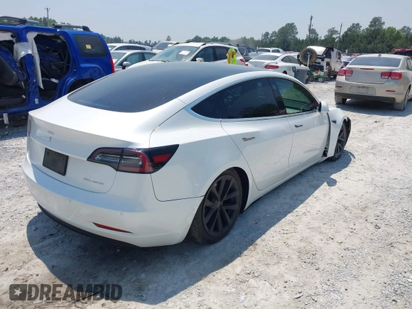 2019 Tesla Model 3 Long Range with VIN 5YJ3E1EB4KF494432, listed as a IAAI auction lot 42009327 with 121,954 mi miles and . Bid and sale history available at DreamBid. Image 4.