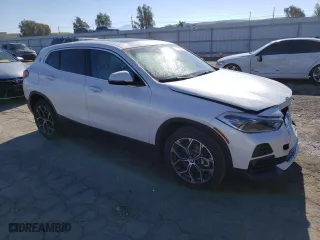 2023 BMW X2 sDrive28i with VIN WBXYH9C01P5V56801, listed as a Copart auction lot 37868343 with 2,516 mi miles. Bid and sale history available at carsss.com. Image 4.
