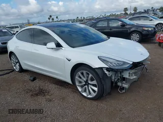 2019 Tesla Model 3 Long Range with VIN 5YJ3E1EBXKF512710, listed as a IAAI auction lot 42063737 with 90,721 mi miles and . Bid and sale history available at carsss.com. Image 1.