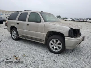 2005 GMC Yukon Denali z VIN 1GKEK63U25J187670, wystawiony jako Copart lot #51669995 z przebiegiem Nie podano mil oraz Nie do naprawy • Non repairable. Historia ofert i sprzedaży dostępna na DreamBid. Obrazek 4.
