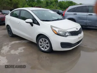 2015 Kia Rio LX with VIN KNADM4A32F6455571, listed as a IAAI auction lot 41970565 with 92,005 mi miles. Bid and sale history available at carsss.com. Image 1.