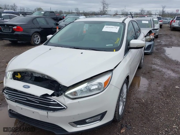 2015 Ford Focus Titanium with VIN 1FADP3N23FL293432, listed as a IAAI auction lot 41929774 with 100,865 mi miles. Bid and sale history available at carsss.com. Image 2.