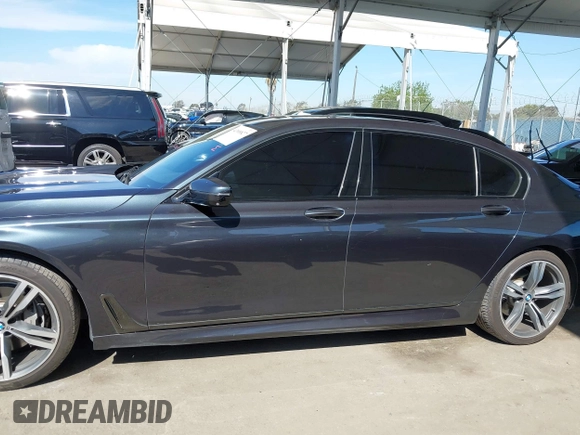 2019 BMW 7 Series 740i with VIN WBA7E2C53KB218375, listed as a IAAI auction lot 42008827 with 61,337 mi miles and . Bid and sale history available at DreamBid. Image 14.