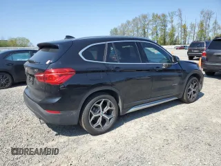 2017 BMW X1 xDrive28i with VIN WBXHT3C32H5F82141, listed as a Copart auction lot 53311785 with 52,867 mi miles and Salvage Title. Bid and sale history available at carsss.com. Image 3.