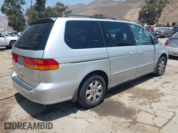 2004 Honda Odyssey EX-L with VIN 5FNRL18774B028164, listed as a IAAI auction lot 42454877 with 135,720 mi miles and . Bid and sale history available at DreamBid. Image 4.