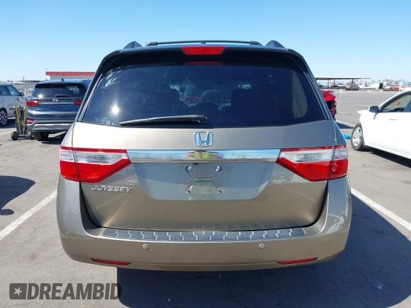 2012 Honda Odyssey EX-L z VIN 5FNRL5H63CB033049, wystawiony jako IAAI lot #42260501 z przebiegiem 165 693 mil mil oraz . Historia ofert i sprzedaży dostępna na DreamBid. Obrazek 17.