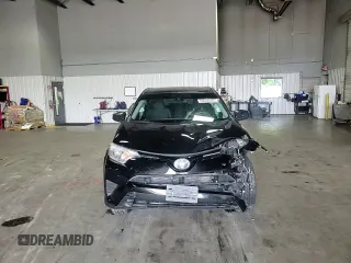 2018 Toyota RAV4 LE with VIN 2T3BFREV6JW763007, listed as a Copart auction lot 58604545 with 107,683 mi miles and Salvage title. Bid and sale history available at DreamBid. Image 14.