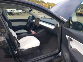 2020 Tesla Model Y Long Range with VIN 5YJYGDEF2LF037298, listed as a IAAI auction lot 37832056 with 40,417 mi miles and . Bid and sale history available at DreamBid. Image 5.