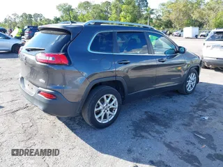2016 Jeep Cherokee Altitude with VIN 1C4PJLCSXGW363598, listed as a IAAI auction lot 41670125 with 135,603 mi miles. Bid and sale history available at carsss.com. Image 4.