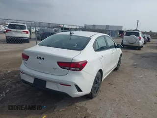 2023 Kia Rio LX with VIN 3KPA24AD8PE554153, listed as a IAAI auction lot 41710165 with 23,879 mi miles. Bid and sale history available at carsss.com. Image 4.
