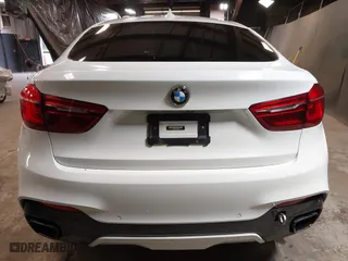 2019 BMW X6 sDrive35i with VIN 5UXKU0C5XK0S97686, listed as a IAAI auction lot 40436492 with 105,584 mi miles. Bid and sale history available at carsss.com. Image 16.
