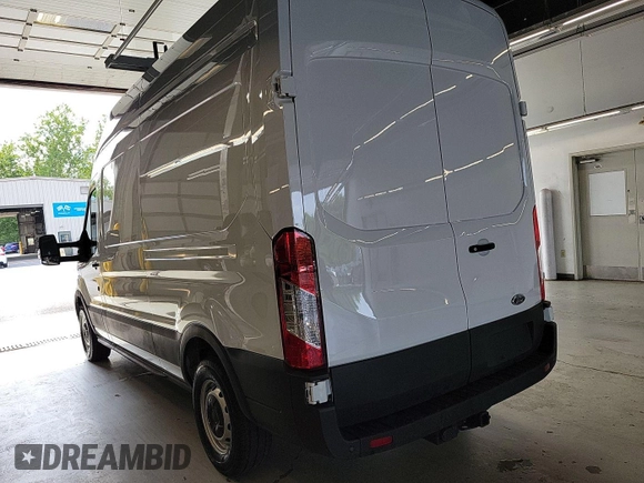 2023 Ford Transit Cargo with VIN 1FTBR1X86PKB99022, listed as a IAAI auction lot 42841650 with 14,234 mi miles and . Bid and sale history available at DreamBid. Image 23.