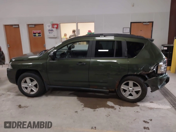 2008 Jeep Compass Sport with VIN 1J8FF47W28D534267, listed as a IAAI auction lot 42009243 with 122,720 mi miles and . Bid and sale history available at carsss.com. Image 14.